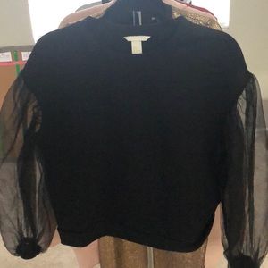 Black blouse with sheer sleeves